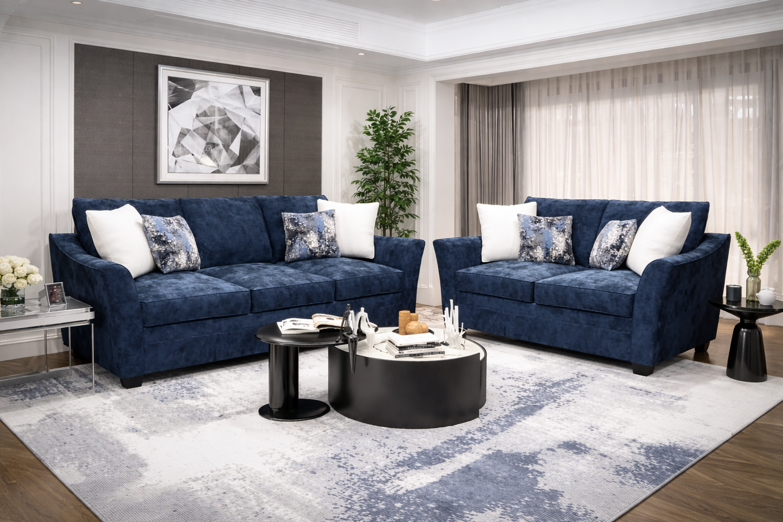 Blue-grey upholstered sofa and loveseat set with accent pillows in a modern living room